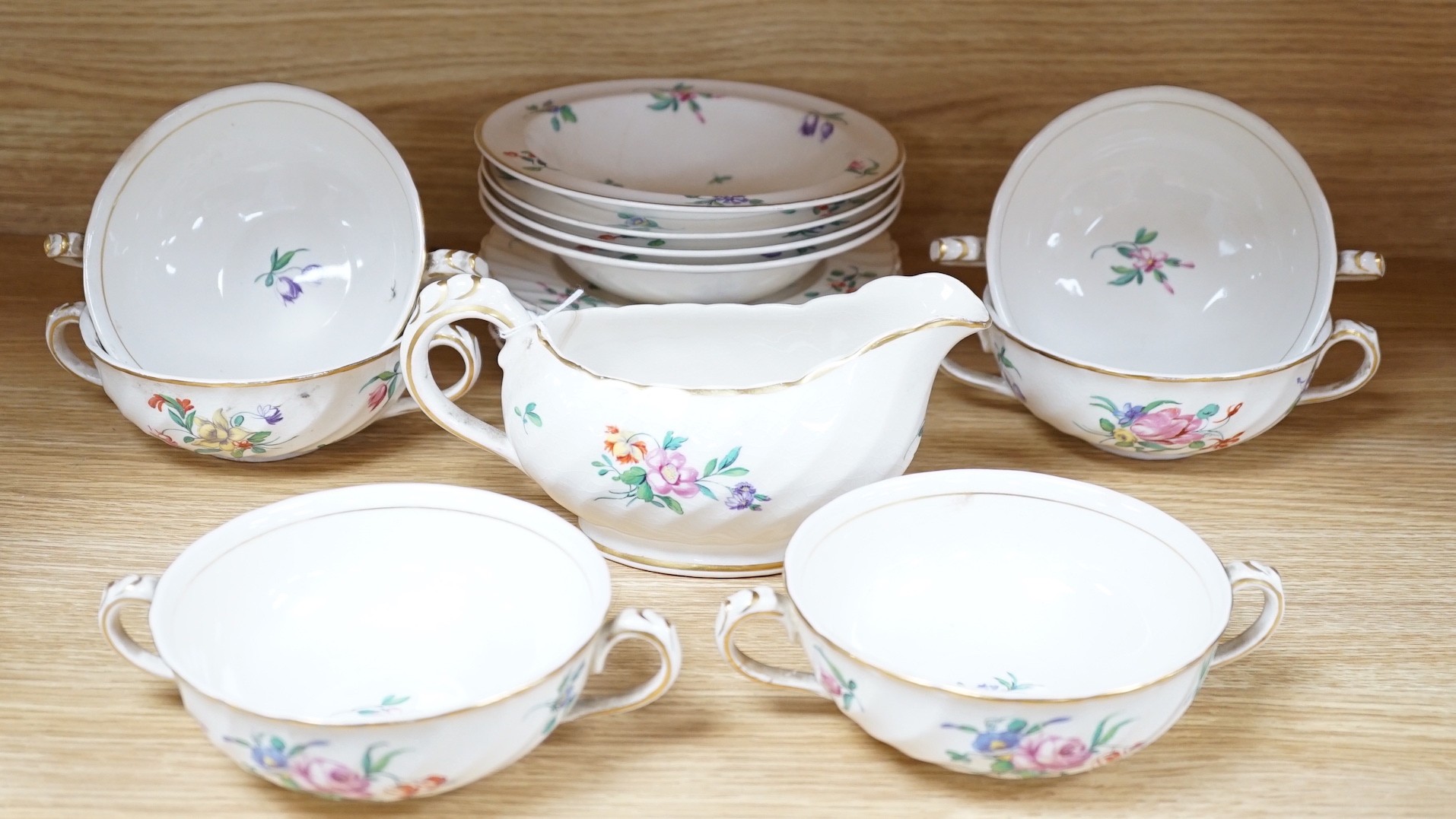 A part Clarice Cliff dinner set. With soup bowls, gravy bowl, etc. with flower decoration